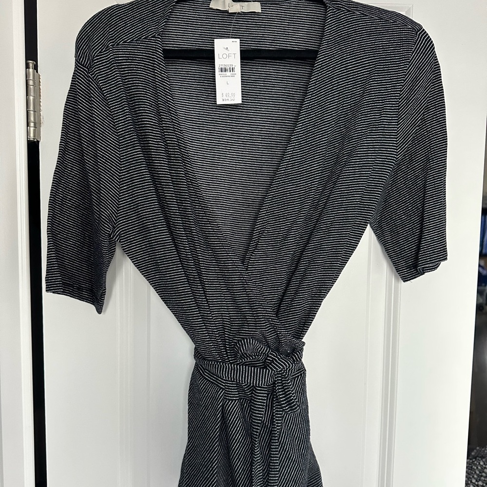Ann Taylor loft wrap top. Black and white striped. Peplum bottom. NWT